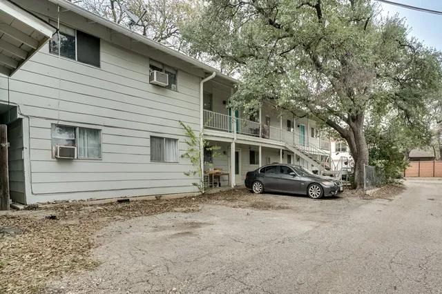 a view of a car park in front of house