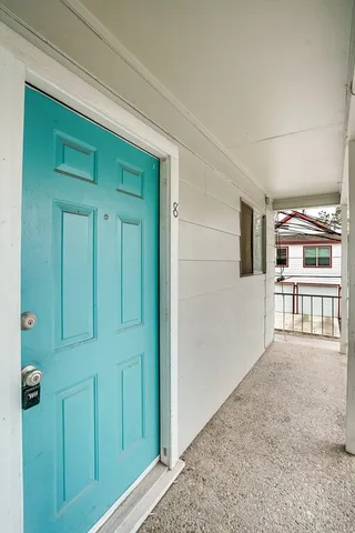 a view of a livingroom with a kitchen