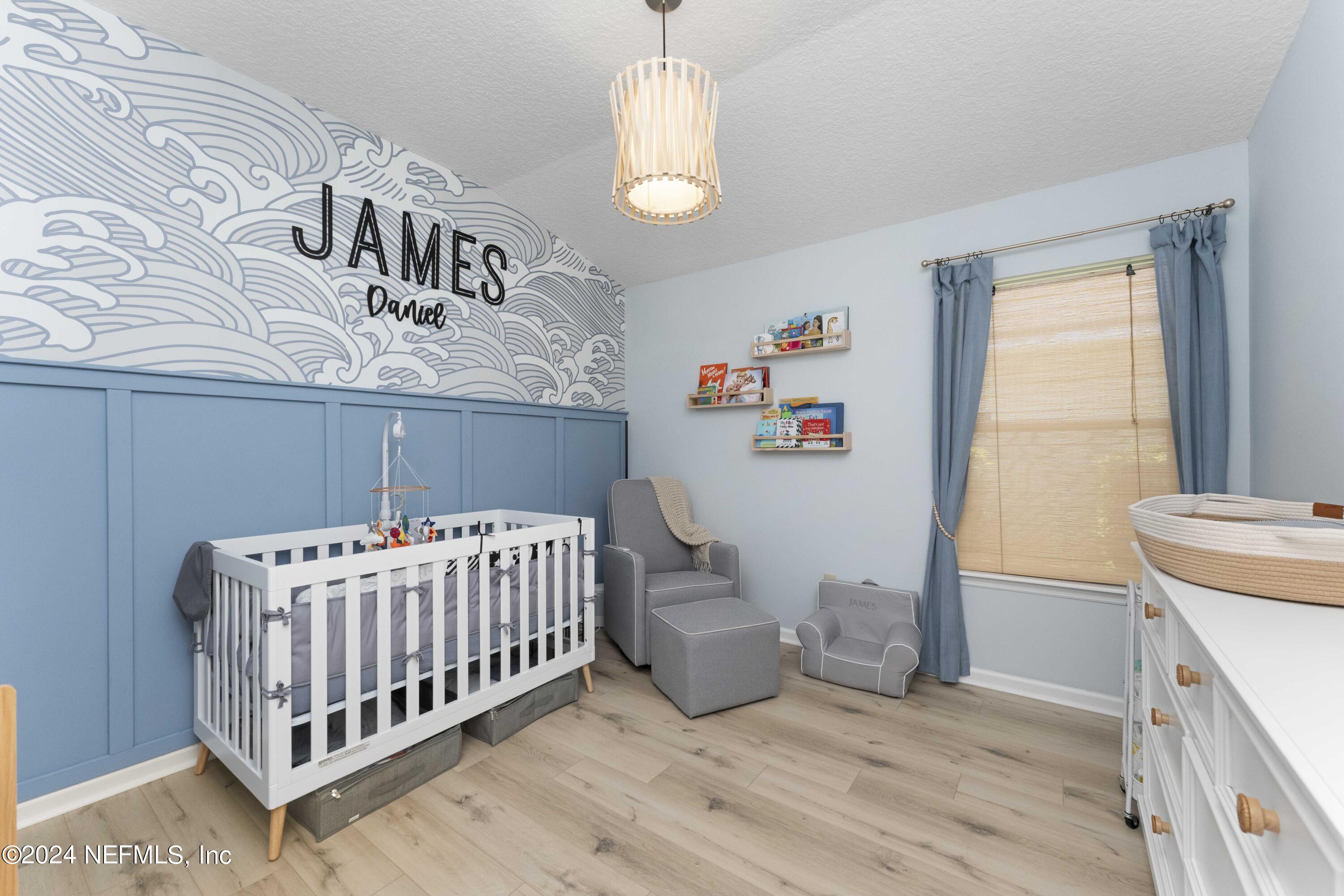 14498 Falling Waters Drive Jacksonville, FL 32258 - Photo 21 of 54 a bedroom with a bed and a window