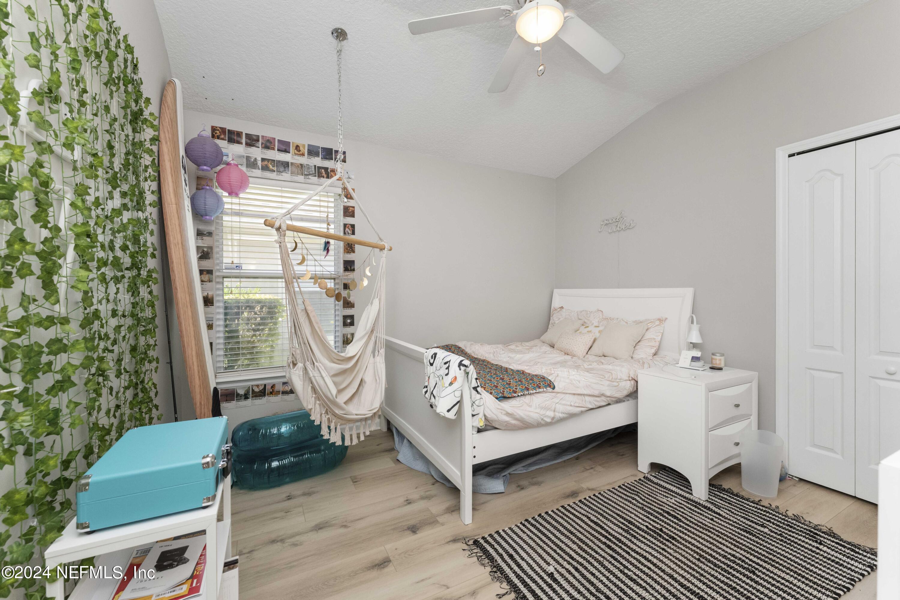 14498 Falling Waters Drive Jacksonville, FL 32258 - Photo 23 of 54 a bedroom with furniture and a potted plant