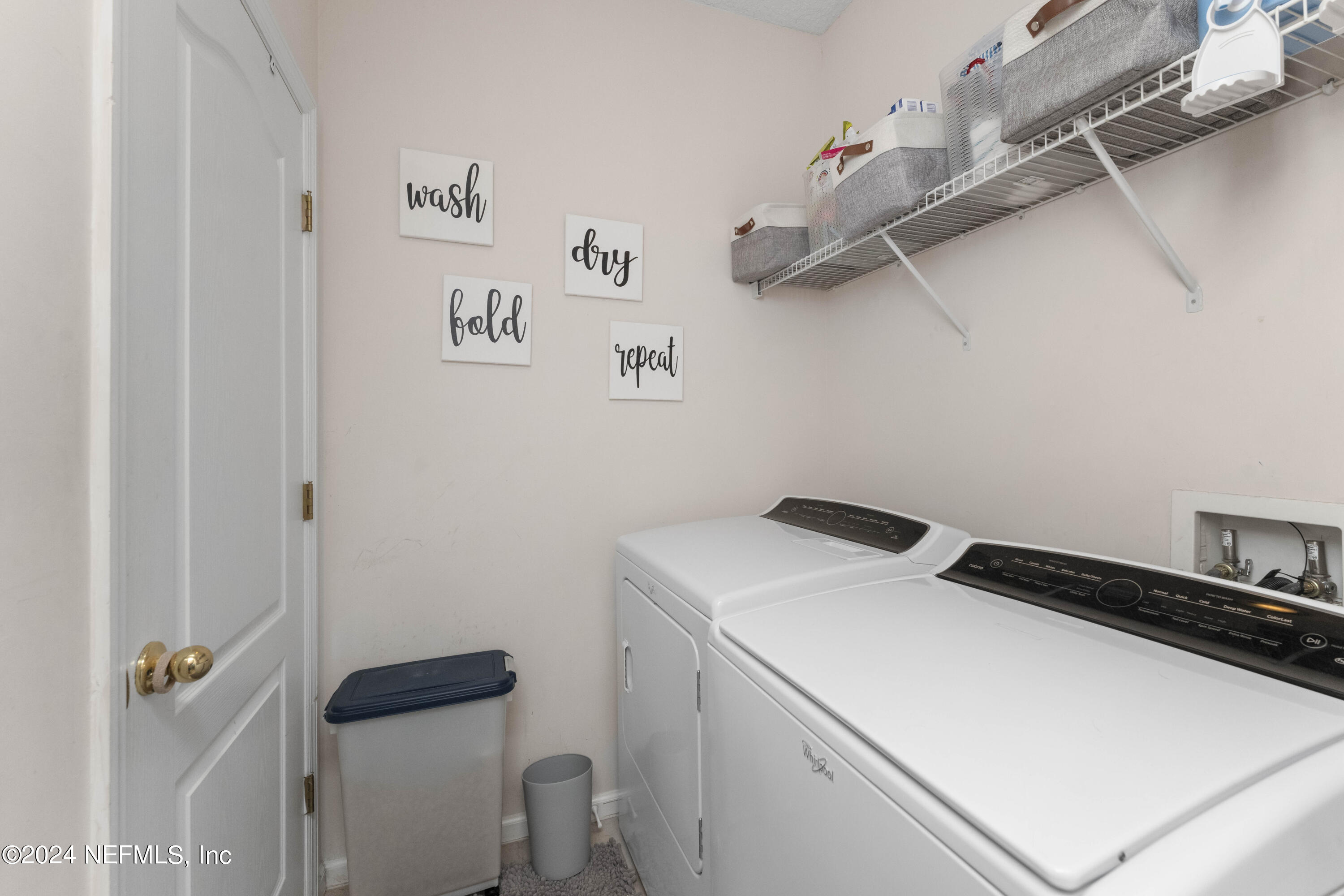 14498 Falling Waters Drive Jacksonville, FL 32258 - Photo 24 of 54 a utility room with dryer and washer