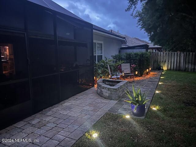 14498 Falling Waters Drive Jacksonville, FL 32258 - Photo 32 of 54 a backyard of a house with table and chairs