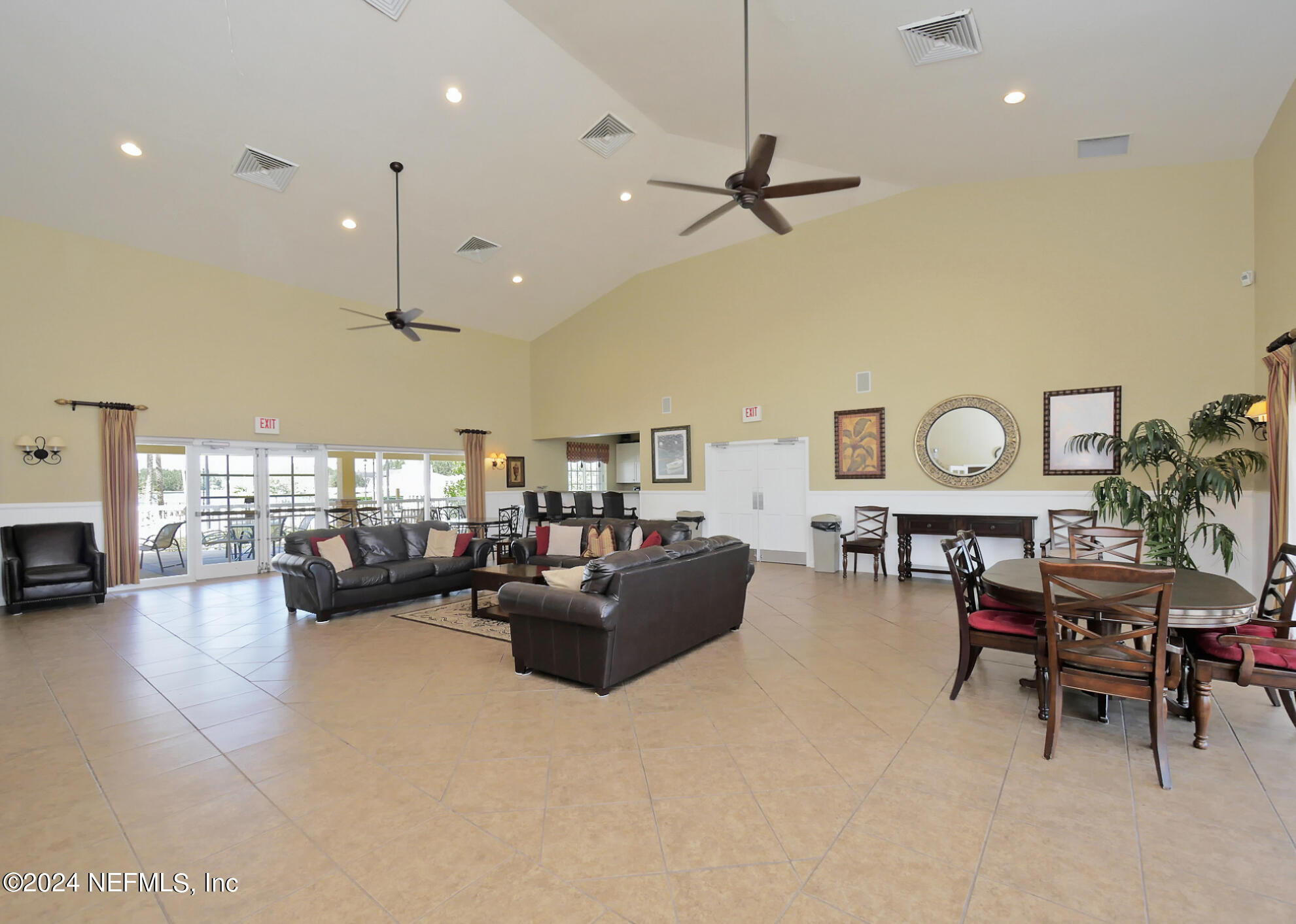 14498 Falling Waters Drive Jacksonville, FL 32258 - Photo 43 of 54 a living room with furniture and a large window