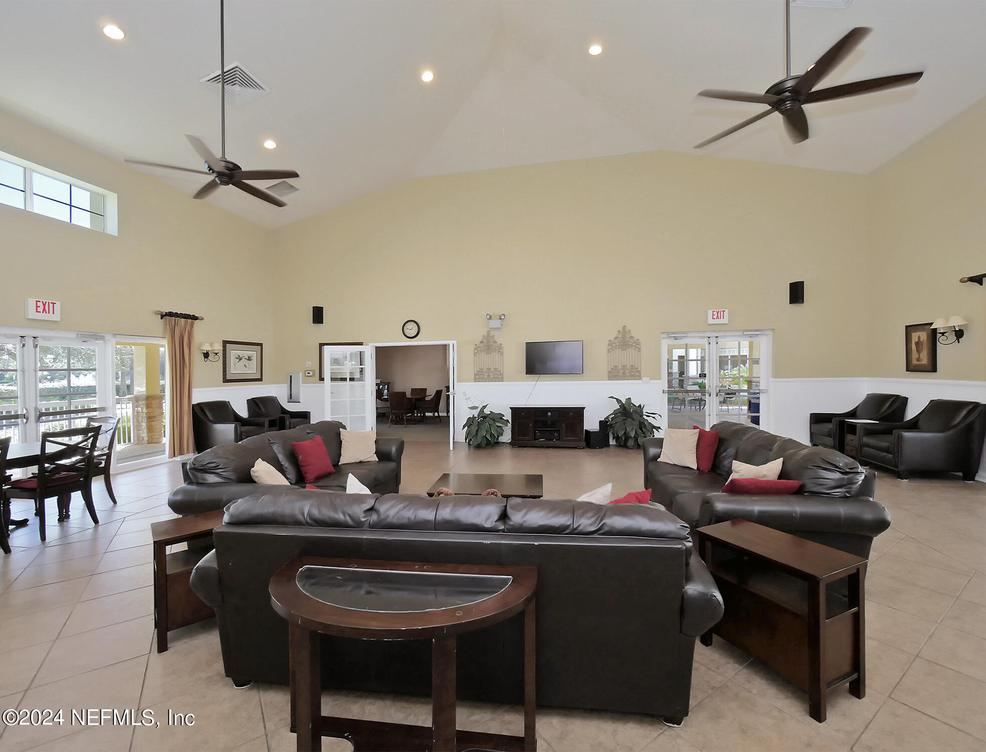 14498 Falling Waters Drive Jacksonville, FL 32258 - Photo 44 of 54 a living room with furniture a rug and a chandelier