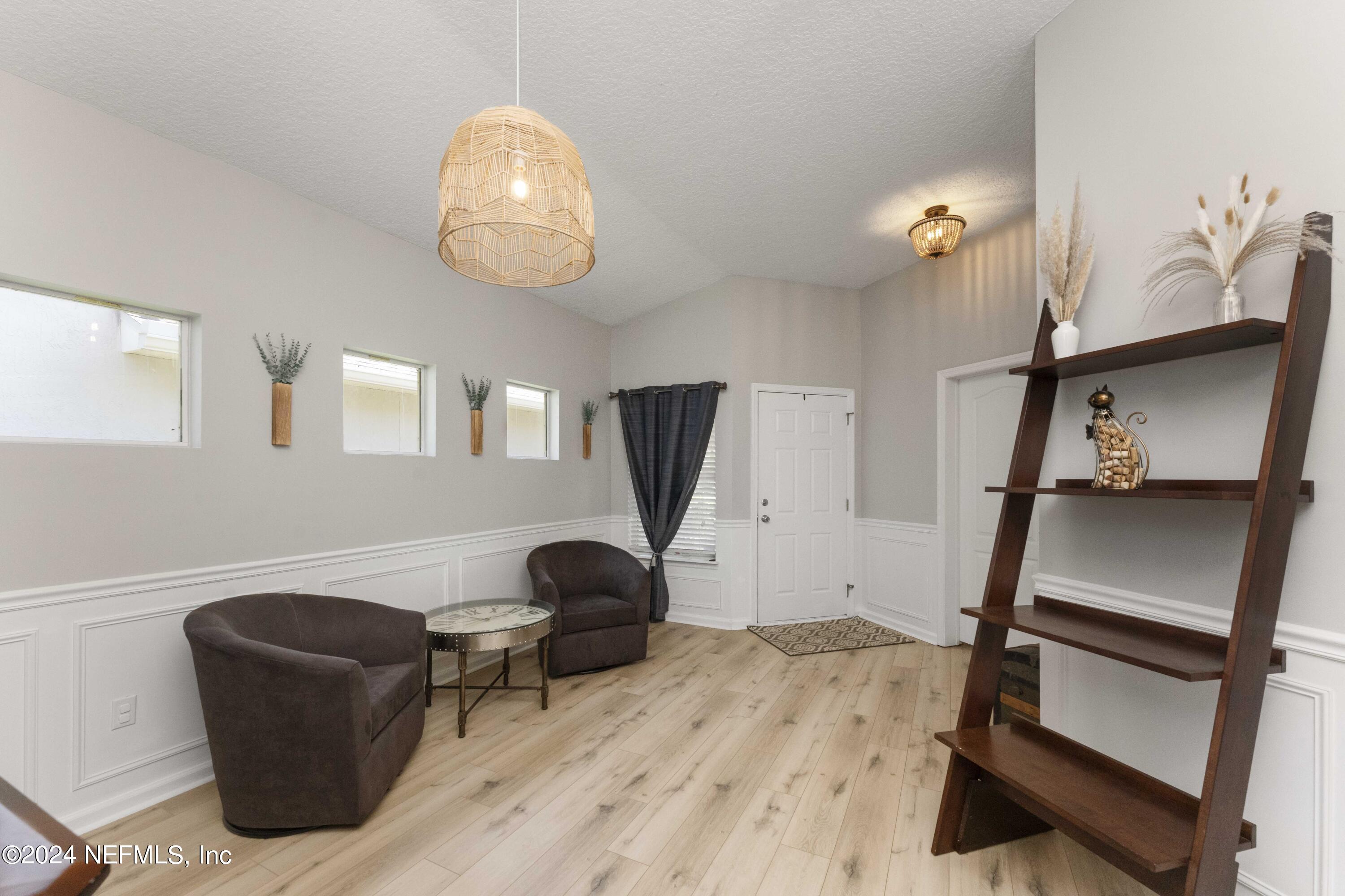 14498 Falling Waters Drive Jacksonville, FL 32258 - Photo 6 of 54 a view of a livingroom with furniture and a window