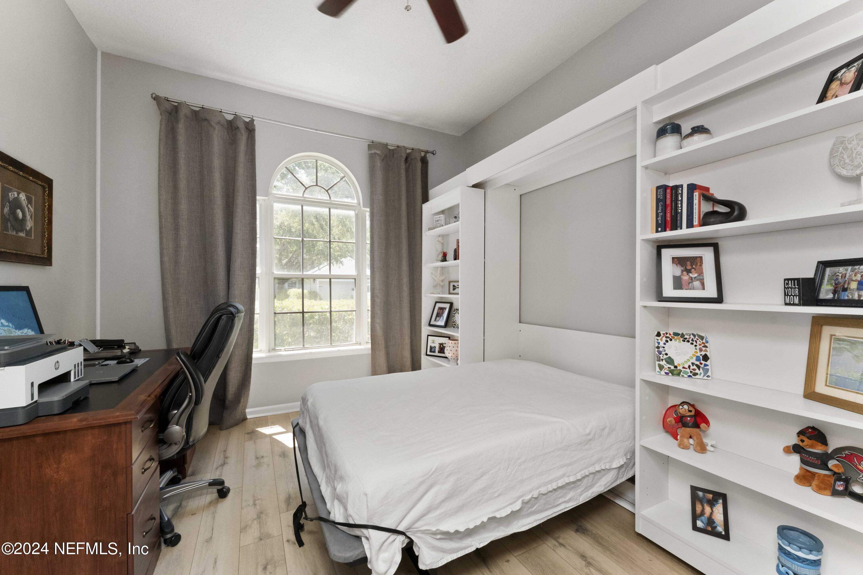 14498 Falling Waters Drive Jacksonville, FL 32258 - Photo 8 of 54 a bedroom with a bed and a window