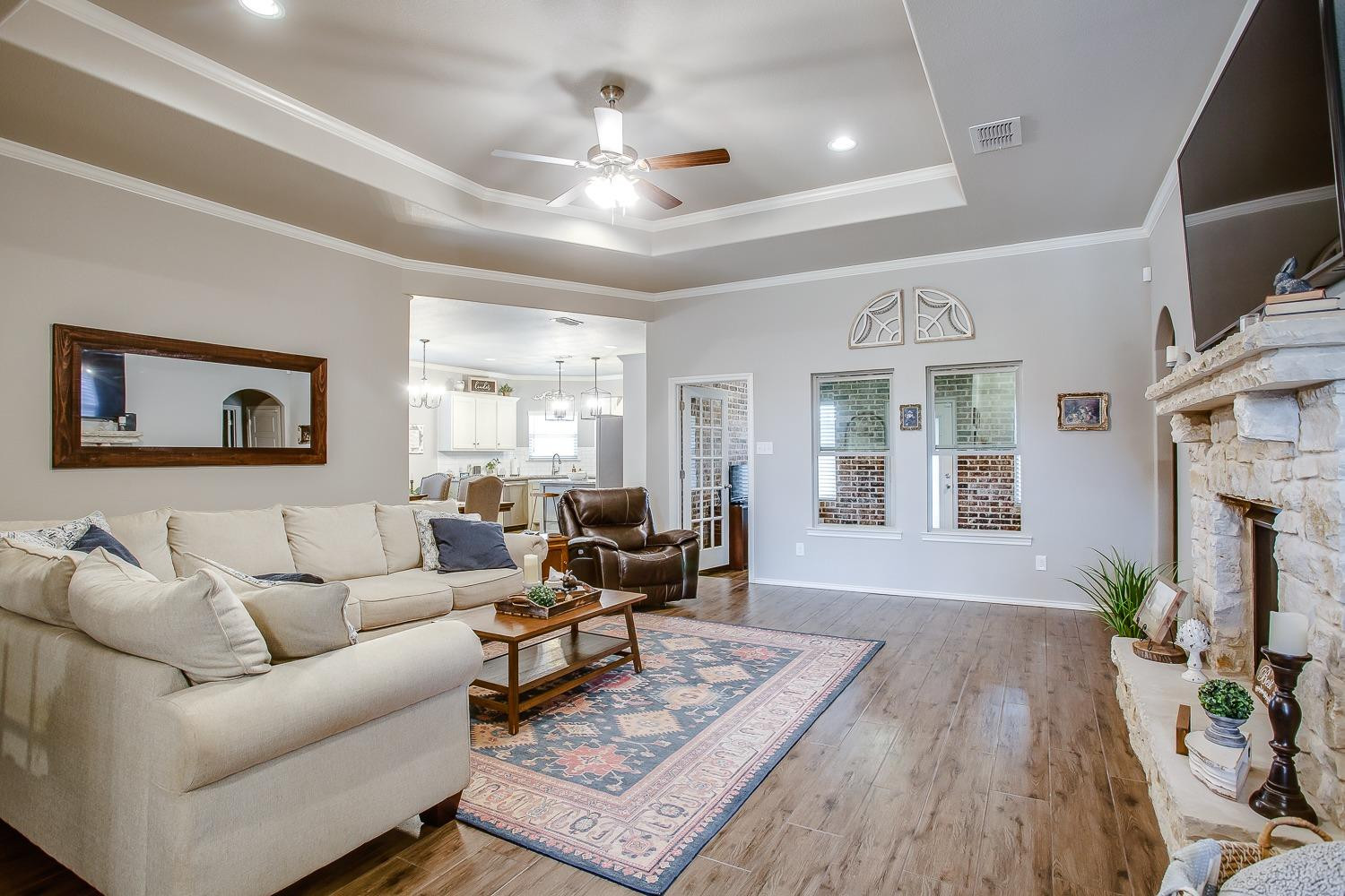 3911 127th Street Lubbock, TX 79423 - Photo 2 of 33 a living room with furniture and a wooden floor