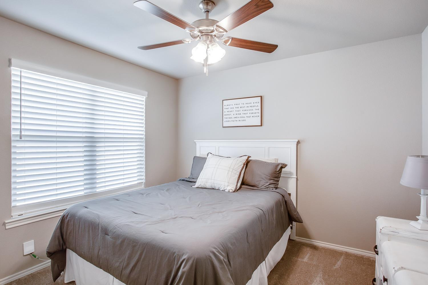 3911 127th Street Lubbock, TX 79423 - Photo 25 of 33 a bedroom with a bed and a window