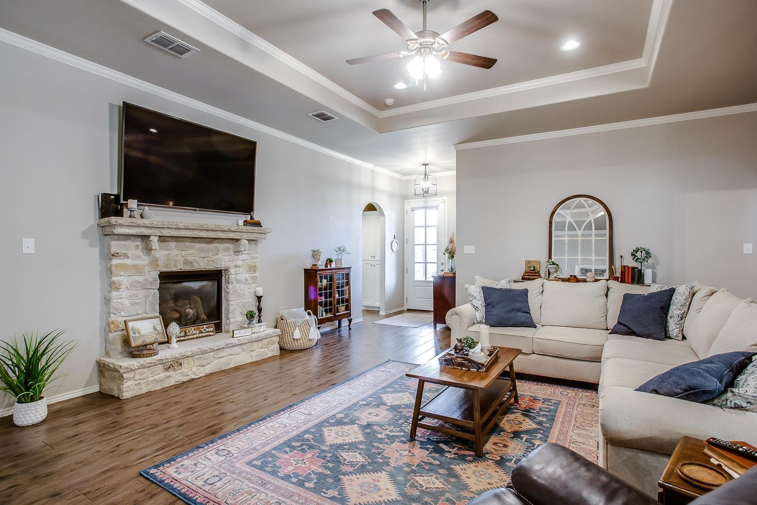 3911 127th Street Lubbock, TX 79423 - Photo 4 of 33 a living room with furniture fireplace and flat screen tv