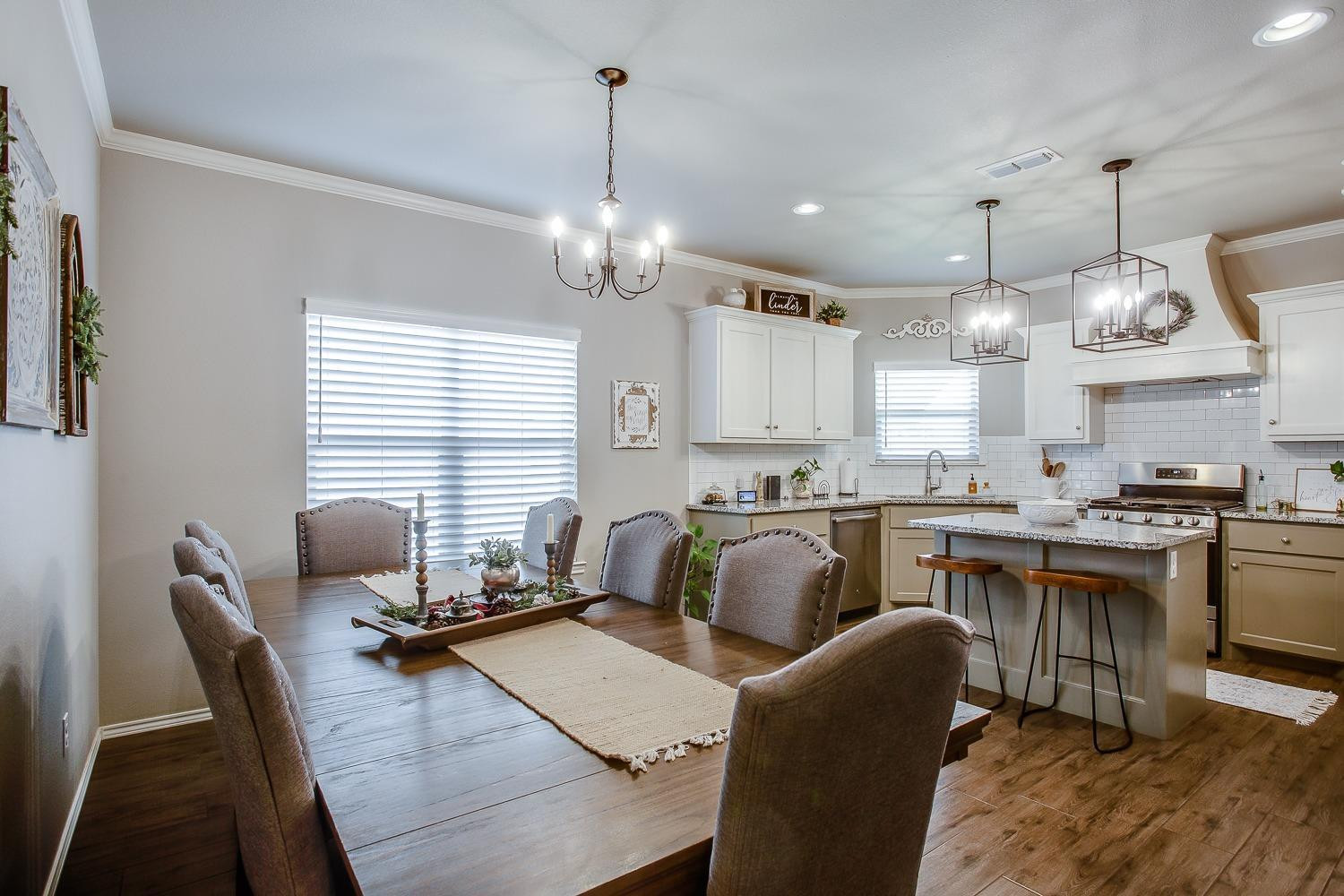 3911 127th Street Lubbock, TX 79423 - Photo 7 of 33 a large kitchen with a table and chairs