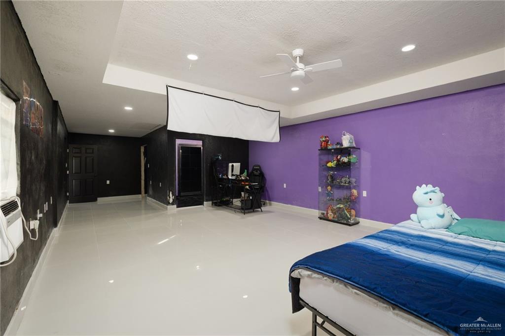 8220 Cardinal Delta Street Mission, TX 78574 - Photo 12 of 18 a view of a room with gym equipment
