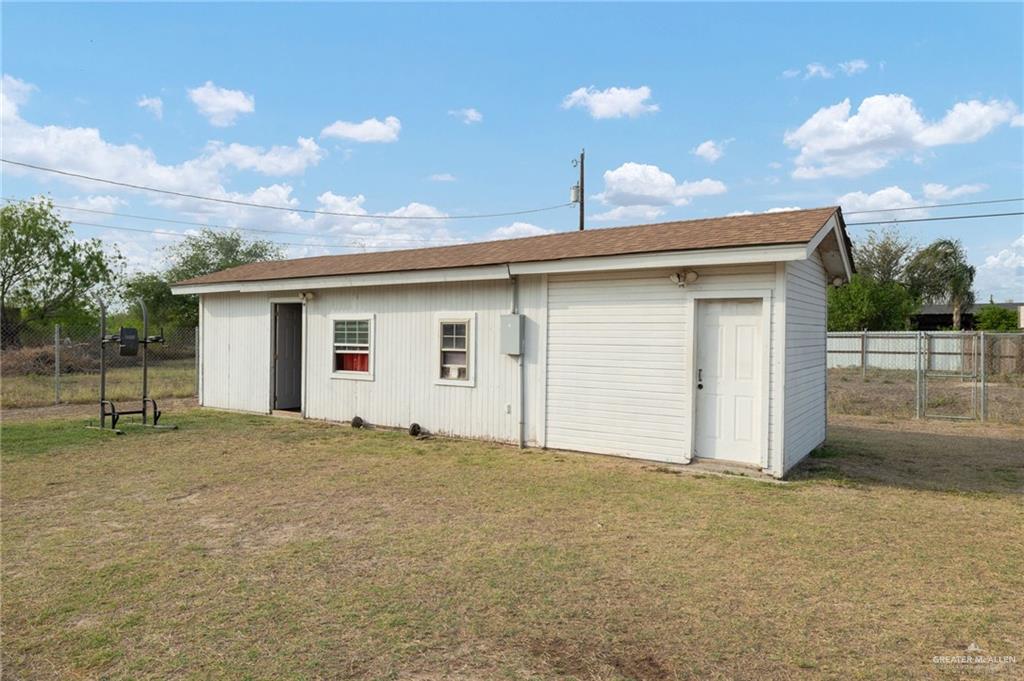 8220 Cardinal Delta Street Mission, TX 78574 - Photo 16 of 18 a view of an house with backyard and a garden