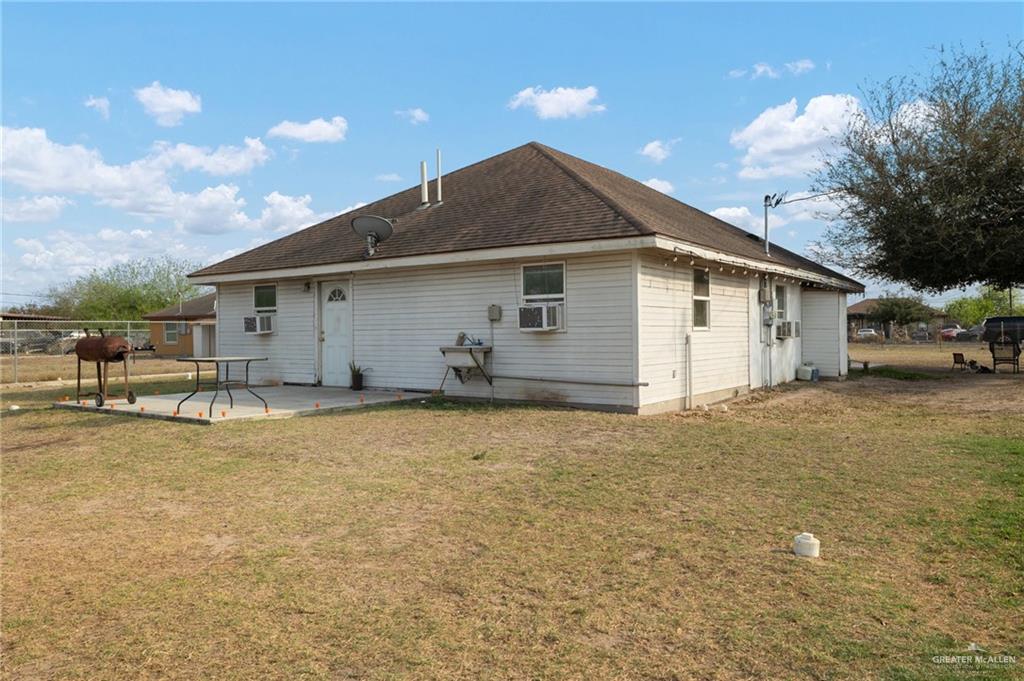 8220 Cardinal Delta Street Mission, TX 78574 - Photo 17 of 18 a front view of house with yard and trees in the background