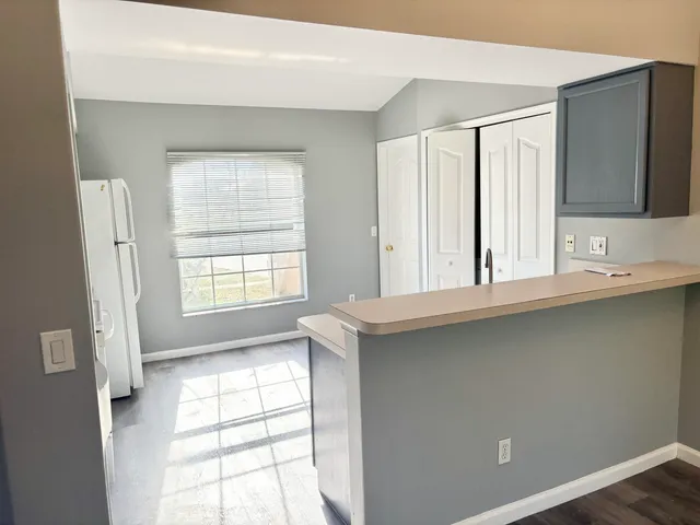 a bathroom with a double vanity sink window and mirror
