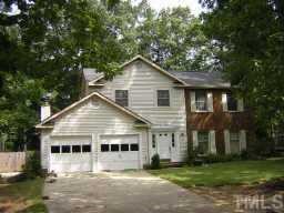 105 Old Bellows Court Raleigh, NC 27607 - Photo 1 of 1 a front view of a house with a yard and trees