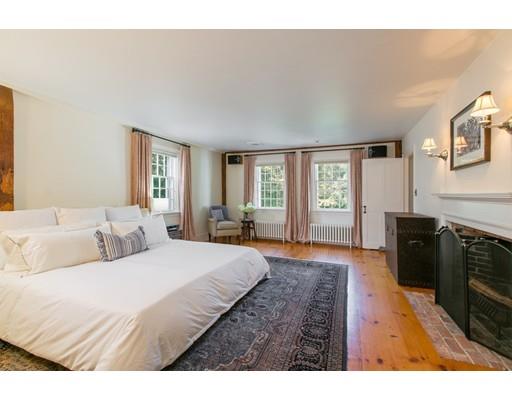 397 River Road Carlisle, MA 01741 - Photo 15 of 30 a bedroom with a bed and wooden floor