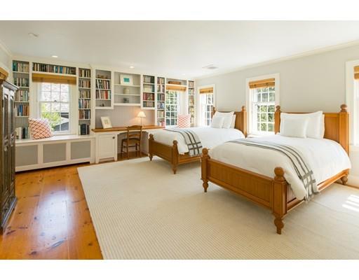 397 River Road Carlisle, MA 01741 - Photo 18 of 30 a spacious bedroom with a bed and wooden floor