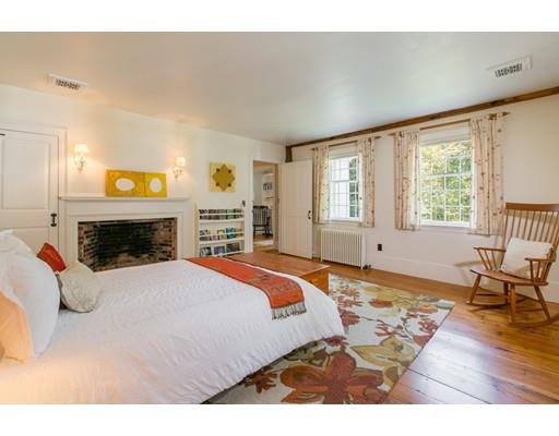 397 River Road Carlisle, MA 01741 - Photo 19 of 30 a bedroom with a bed and wooden floor