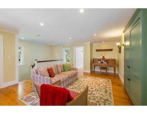 397 River Road Carlisle, MA 01741 - Photo 22 of 30 a living room with furniture wooden floor and a table