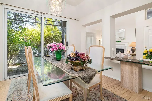 a dining room with furniture and wooden floor