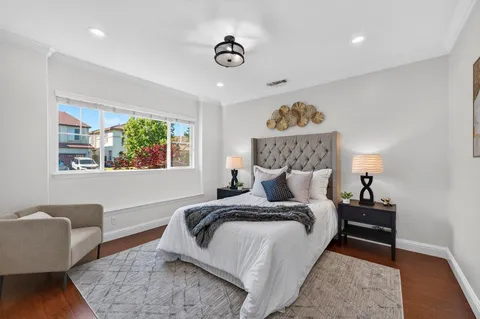a bedroom with a bed and a couch