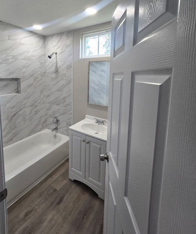 4834 Clover Street Houston, TX 77033 - Photo 7 of 10 a bathroom with a tub sink and mirror
