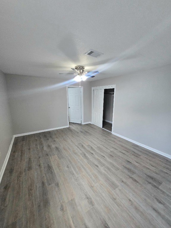 4834 Clover Street Houston, TX 77033 - Photo 8 of 10 a view of an empty room with wooden floor
