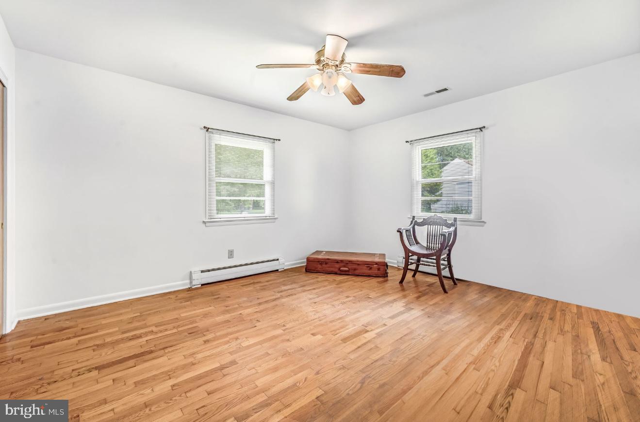 6827 Bellevue Road Royal Oak, MD 21662 - Photo 18 of 32 a view of workspace with wooden floor and ceiling fan