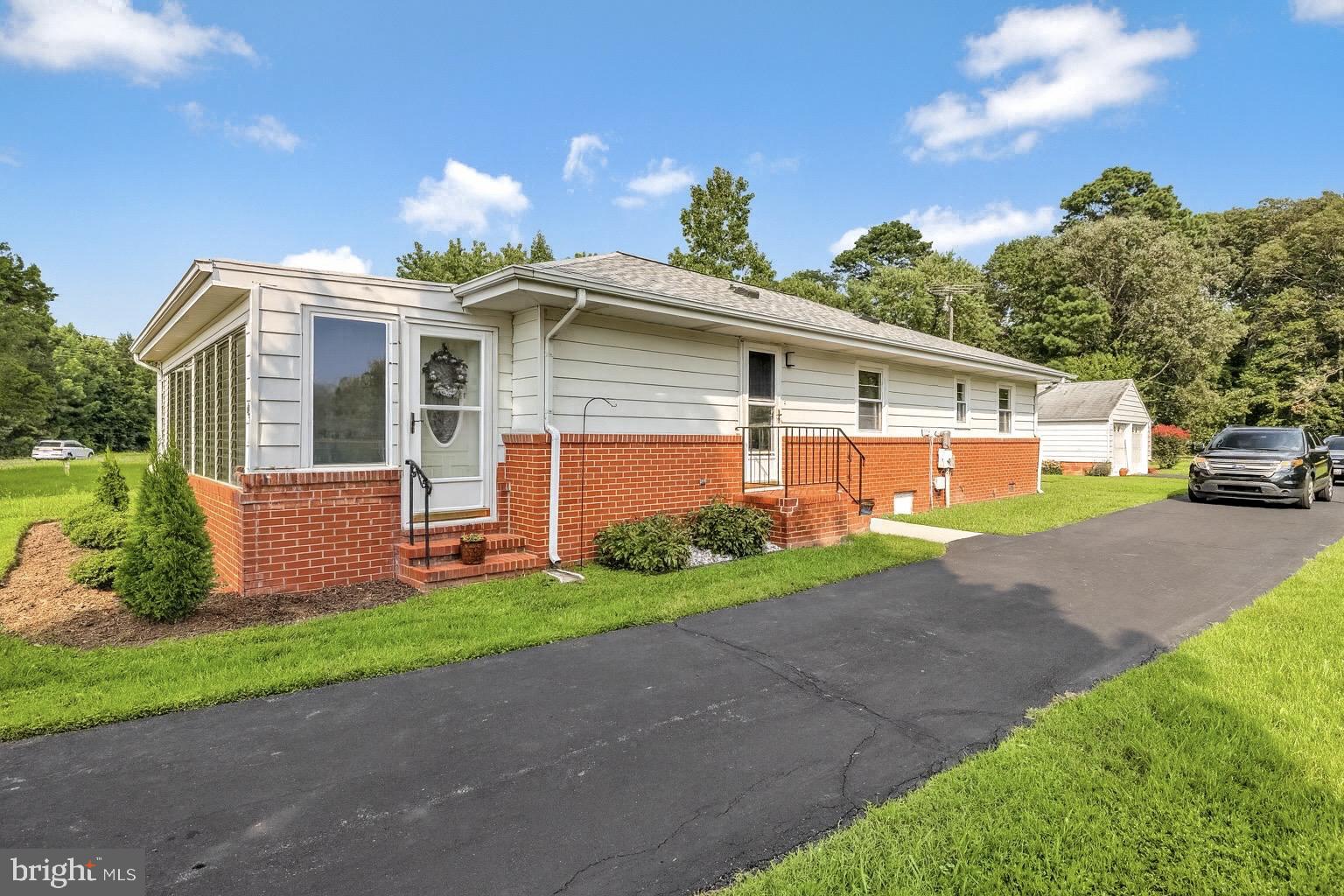 6827 Bellevue Road Royal Oak, MD 21662 - Photo 2 of 32 a front view of house with yard and green space