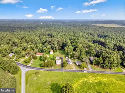 a view of a swimming pool with a yard