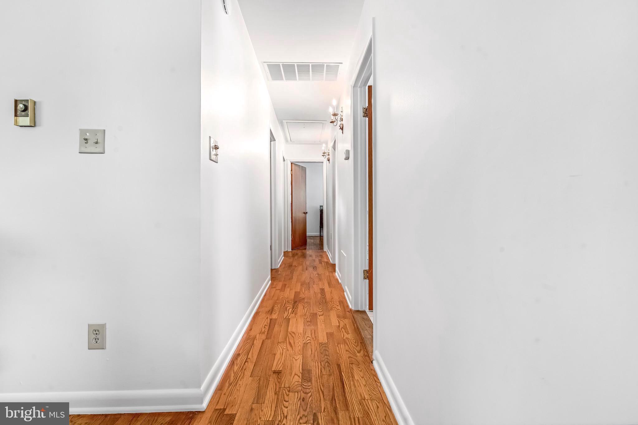 6827 Bellevue Road Royal Oak, MD 21662 - Photo 9 of 32 a view of a hallway with wooden floor