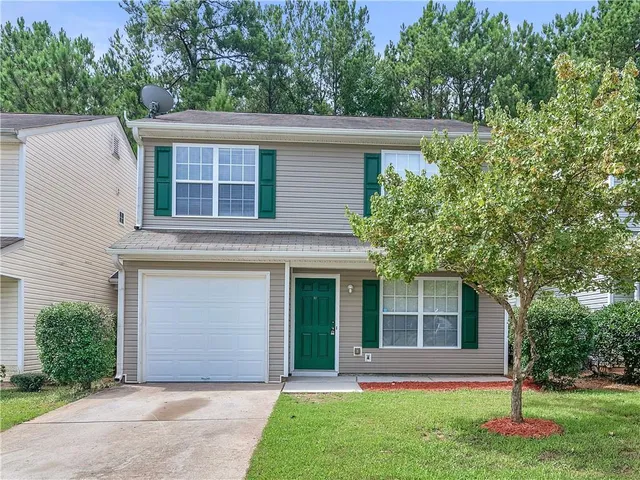 front view of a house with a yard