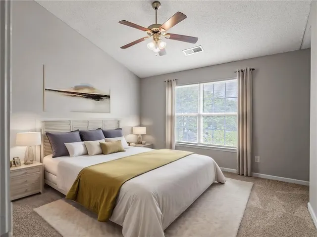 a bedroom with bed and window