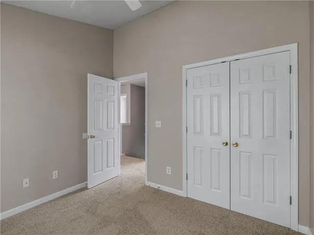 a view of an empty room with entryway