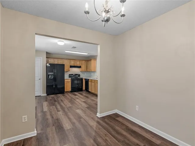 a view of a kitchen with a sink and dishwasher