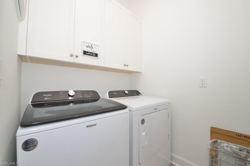 7259 Cayo Coco Lane Naples, FL 34113 - Photo 13 of 20 a utility room with dryer and washer