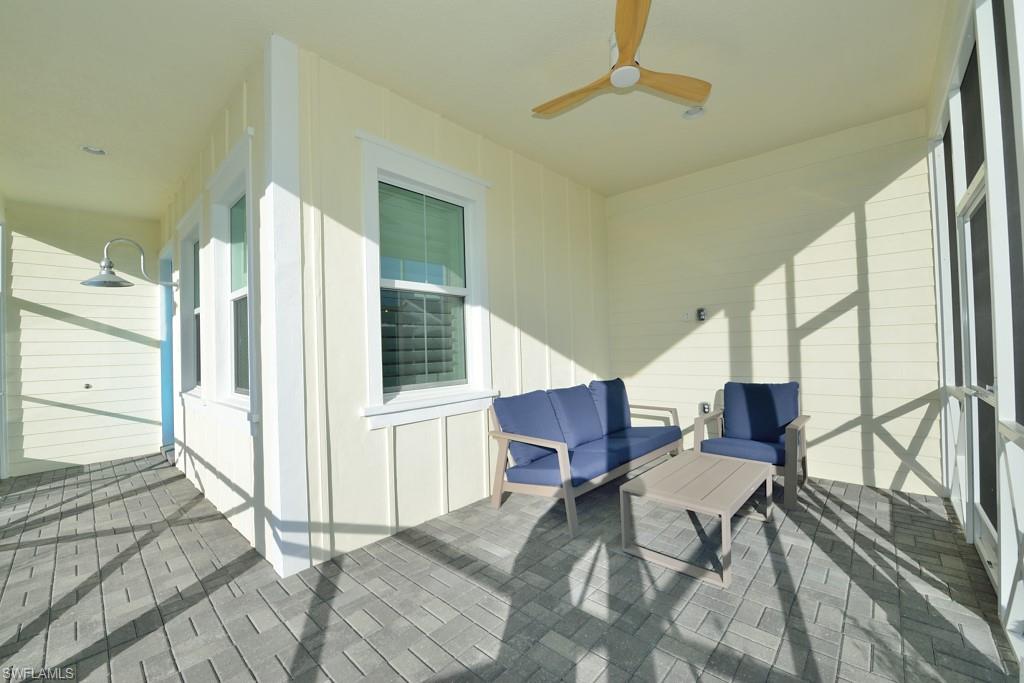 7259 Cayo Coco Lane Naples, FL 34113 - Photo 14 of 20 a living room with furniture stove and a window
