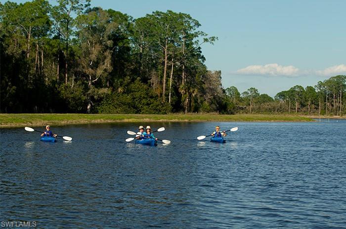 7259 Cayo Coco Lane Naples, FL 34113 - Photo 20 of 20 a view of a lake in a field