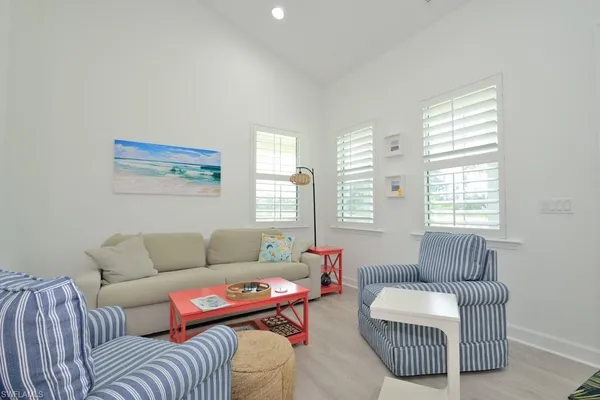 a living room with furniture and a window