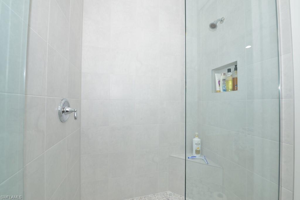 7259 Cayo Coco Lane Naples, FL 34113 - Photo 9 of 20 a bathroom with a shower