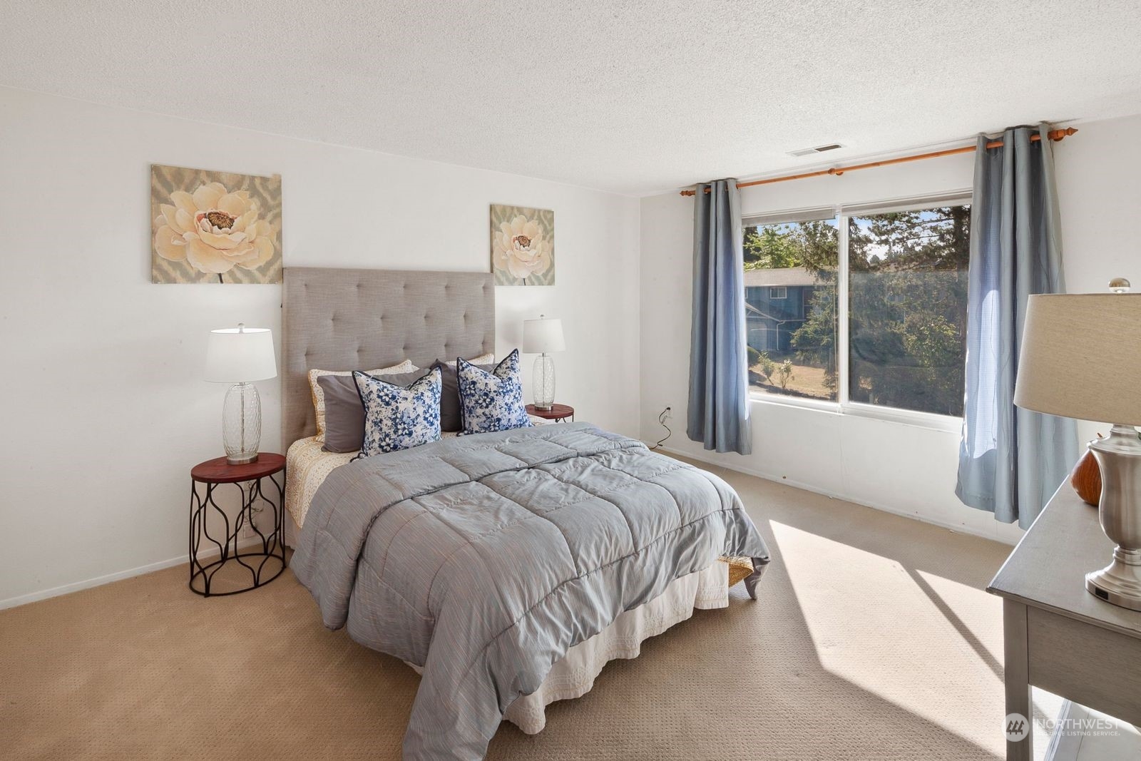 924 South 29th Court Renton, WA 98055 - Photo 15 of 27 a bedroom with bed and a large window