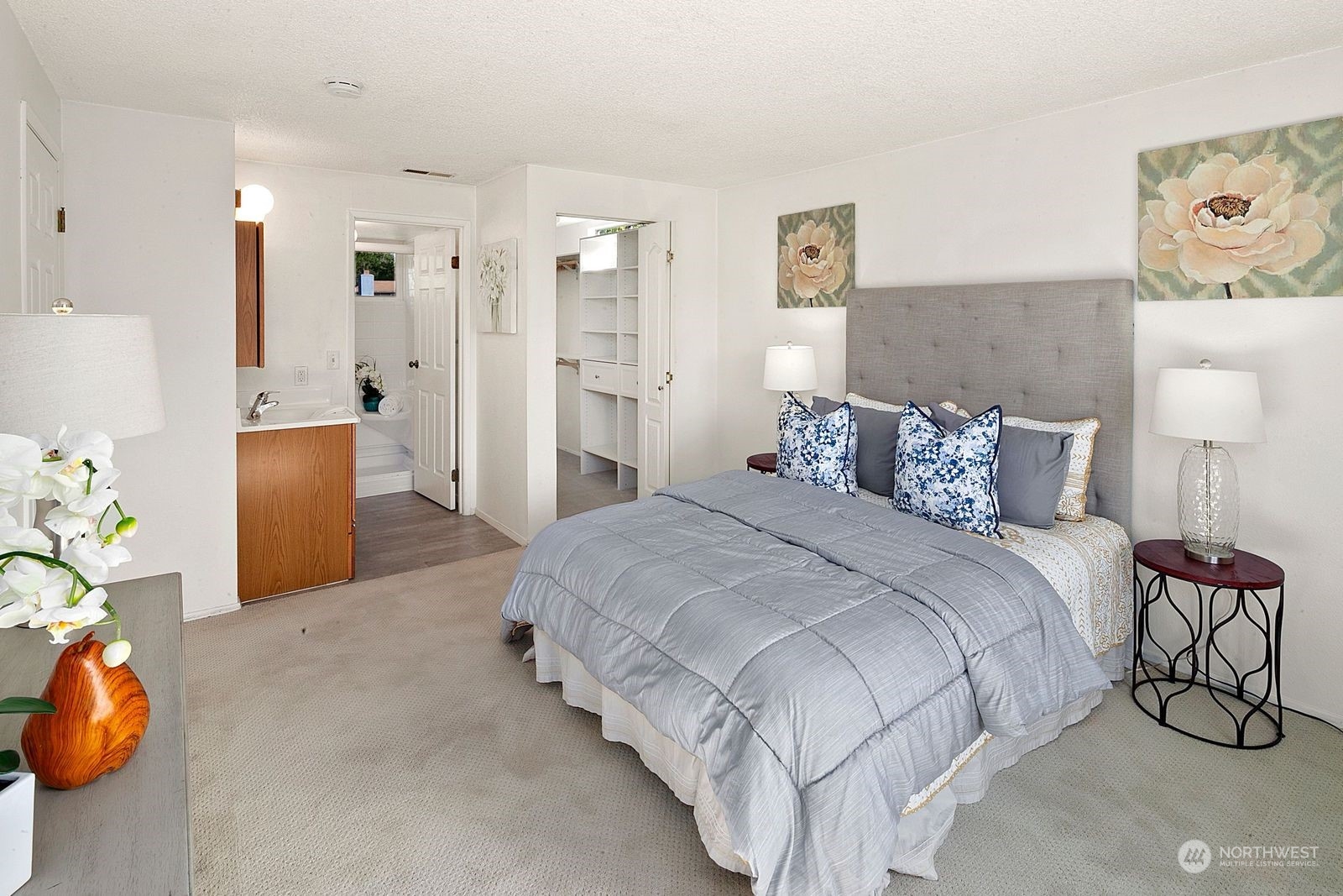 924 South 29th Court Renton, WA 98055 - Photo 16 of 27 a spacious bedroom with a bed and a couch