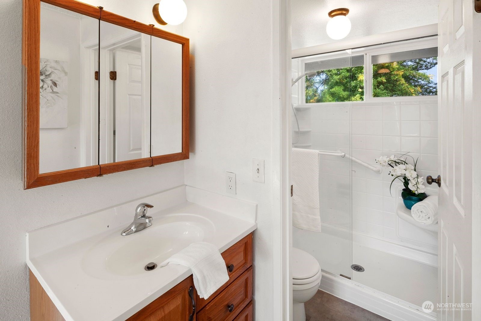924 South 29th Court Renton, WA 98055 - Photo 17 of 27 a bathroom with a sink a toilet and shower