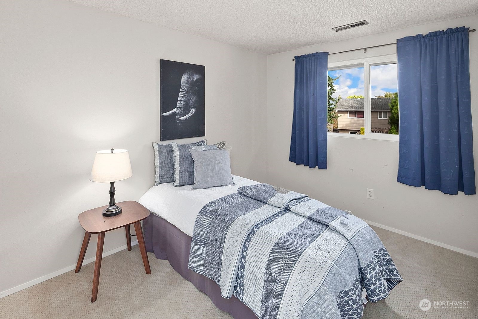 924 South 29th Court Renton, WA 98055 - Photo 20 of 27 a bedroom with a bed and a window