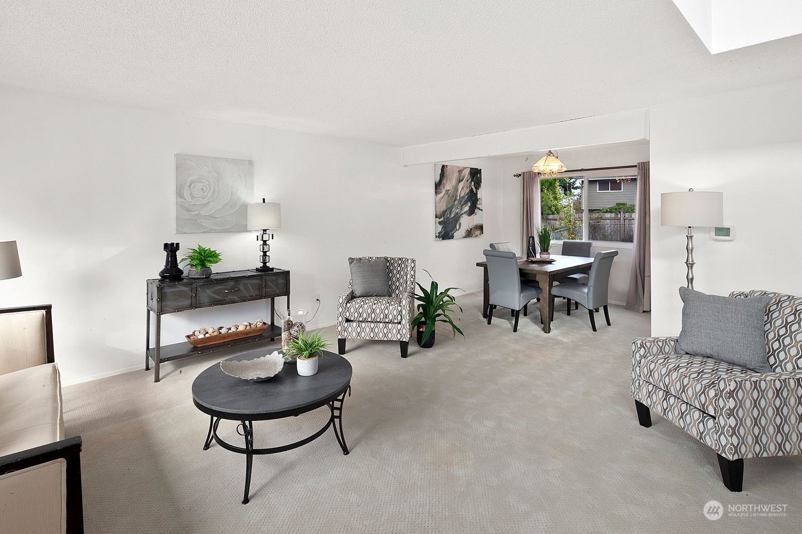 924 South 29th Court Renton, WA 98055 - Photo 2 of 27 a living room with furniture and a large window