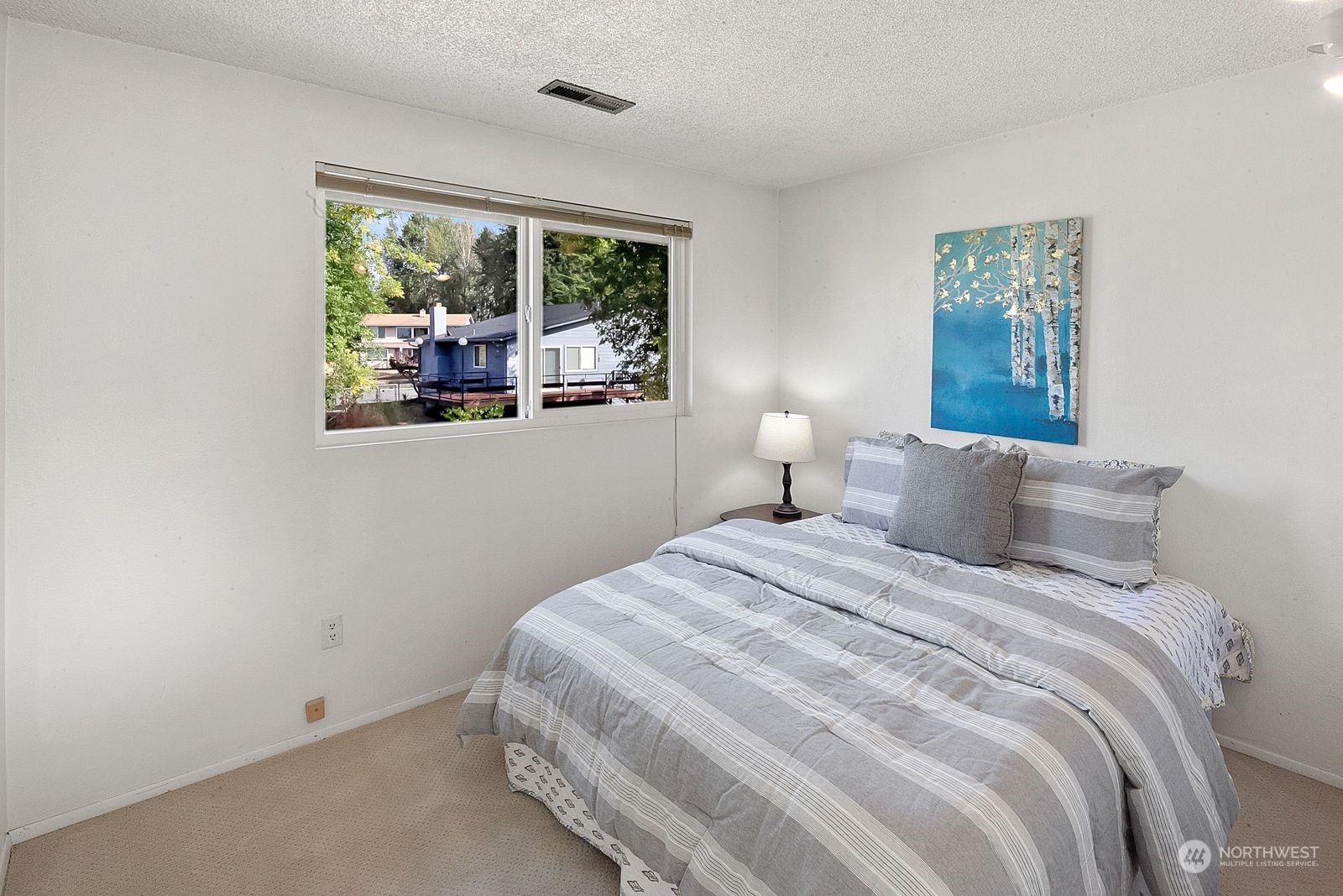 924 South 29th Court Renton, WA 98055 - Photo 21 of 27 a bedroom with a bed and a window
