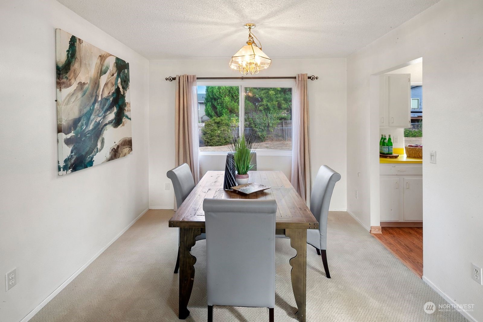 924 South 29th Court Renton, WA 98055 - Photo 5 of 27 a dining room with furniture a window and outside view