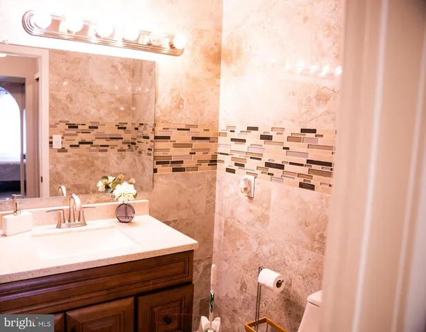 a bathroom with a sink and a window