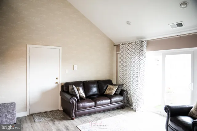 a living room with furniture and a couch