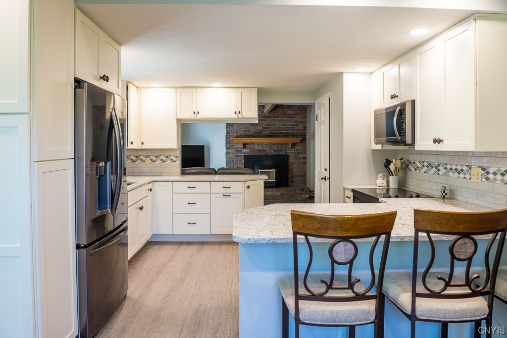 852 Strong Road Tully, NY 13159 - Photo 19 of 42 Updated Kitchen with Quartz Counters and Tile Back